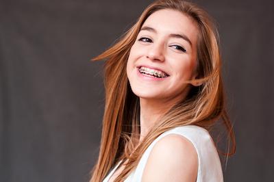 teen girl with braces smiling