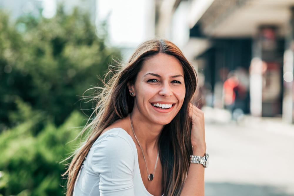 woman smiling with bright, white teeth