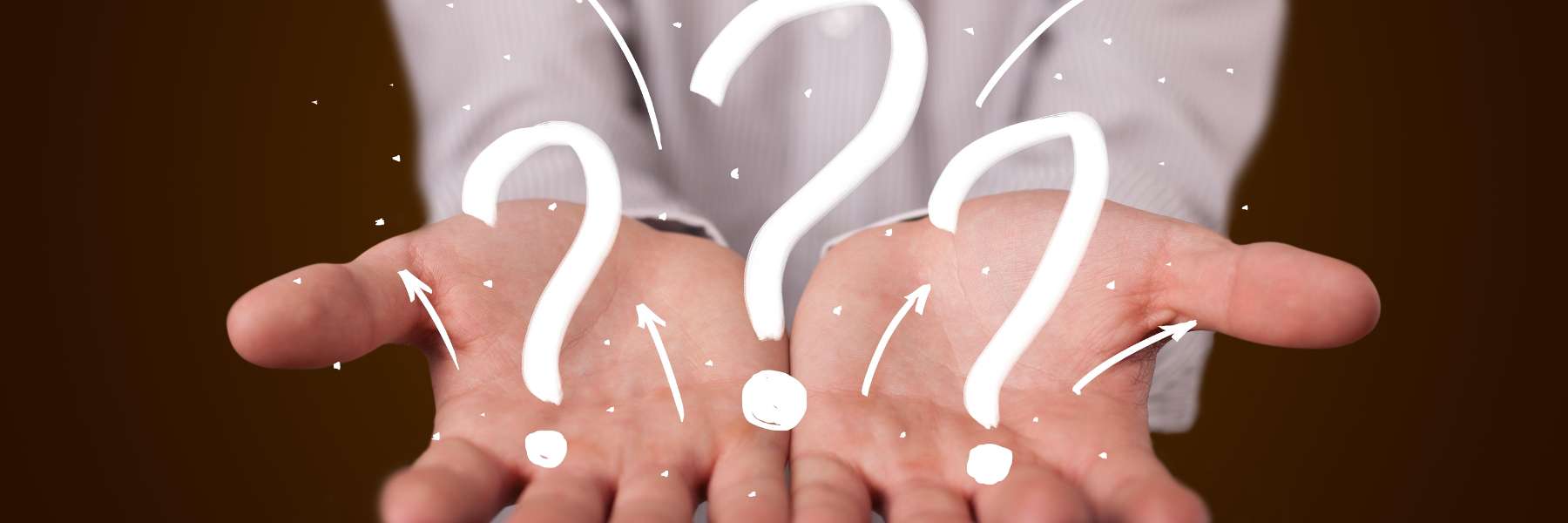 Hands holding question marks | Palatine Complete Dental