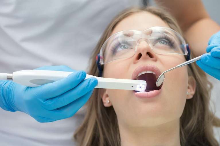 woman getting dental crowns in Palatine, IL