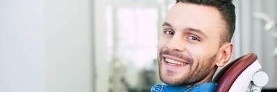 Man smiling at Palatine, IL dentist office