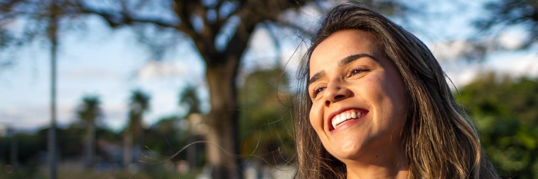 woman smiling after invisalign treatment
