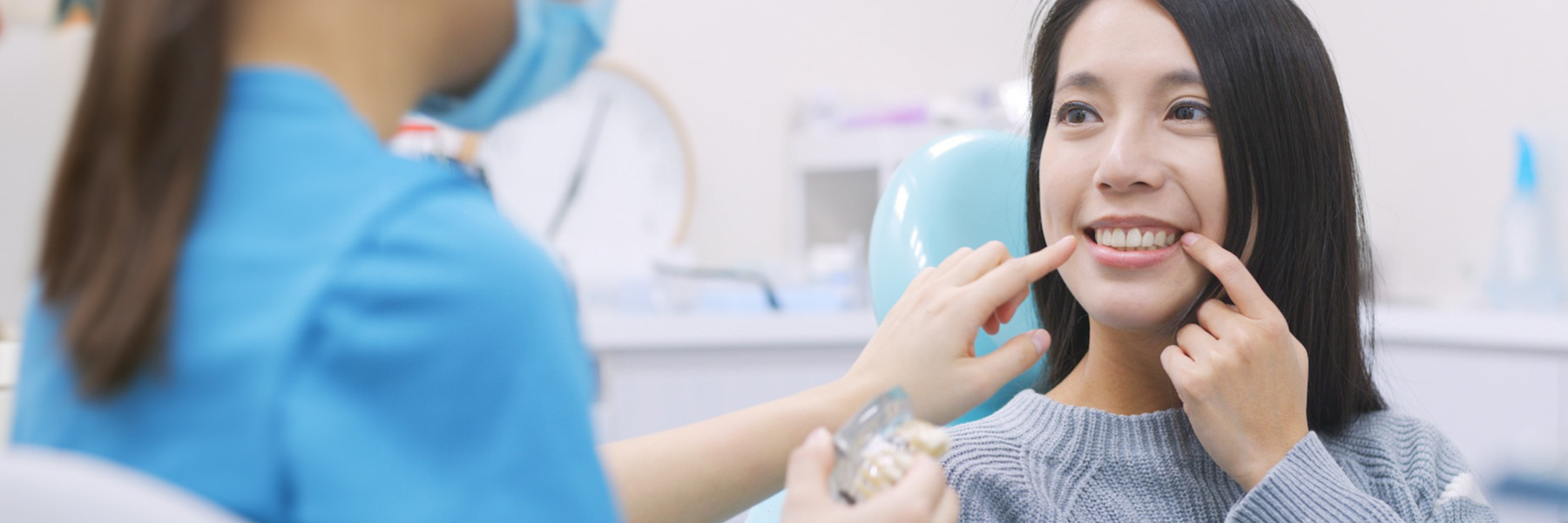 woman smiling after Tooth Extraction